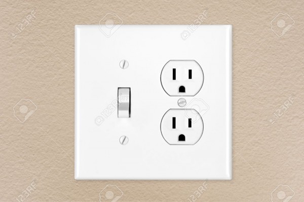 A Brand New Modern Electrical Toggle Light Switch And Power Outlet