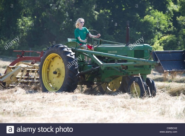 Teenage Girl Raking Hay With John Deere Model 50 Tractor And New